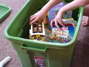 A-girl-packing-up-pieces-of-her-childhood-in-the-Rubbermaid-Roughneck-Tote